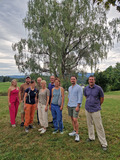 Group picture of the participants under a tree.